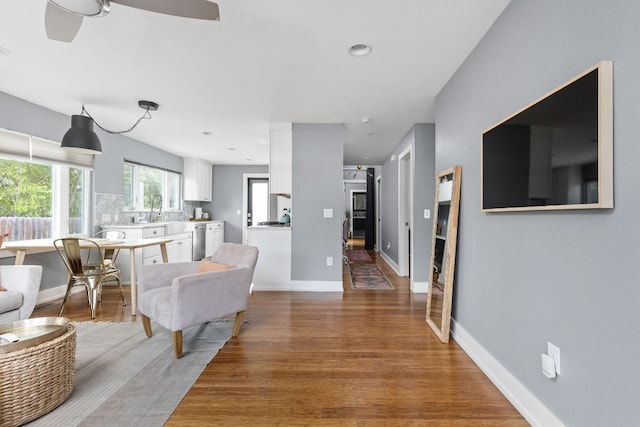 7611 Providence Ave Unit A, Austin, TX 78752 - living area with wood finished floors and ceiling fan