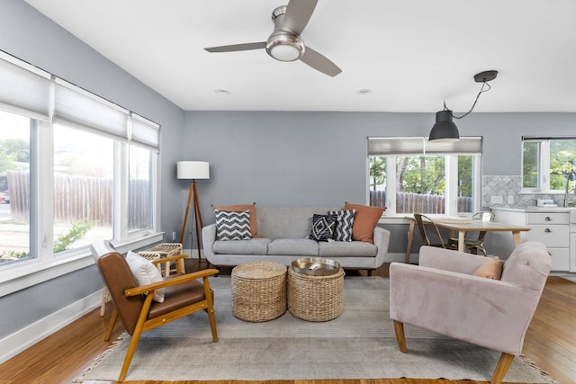 7611 Providence Ave Unit A, Austin, TX 78752 - living room featuring light wood-type flooring and a ceiling fan