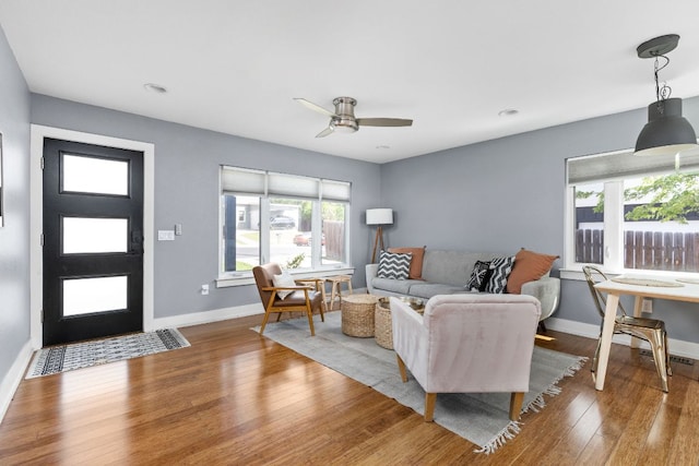 7611 Providence Ave Unit A, Austin, TX 78752 - living area featuring wood finished floors, ceiling fan, and recessed lighting