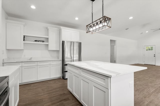 kitchen featuring white cabinets, stainless steel appliances, and dark hardwood / wood-style floors