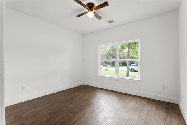 unfurnished room featuring ceiling fan and dark hardwood / wood-style flooring