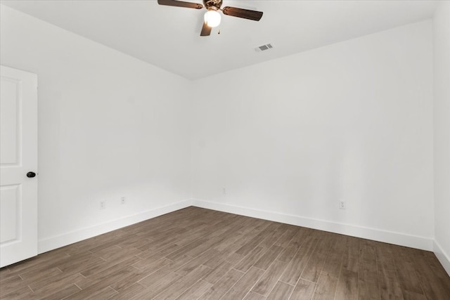 spare room with hardwood / wood-style flooring and ceiling fan