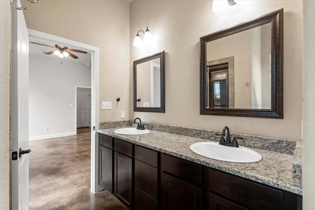 bathroom with ceiling fan and vanity