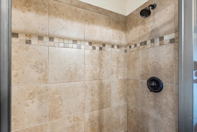 details with a tile shower