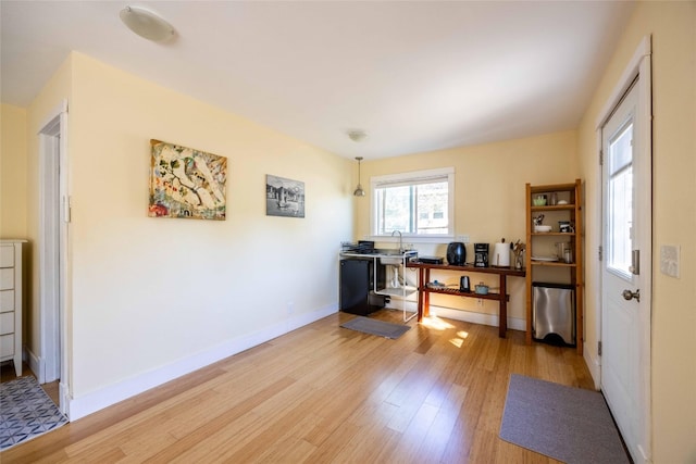 office with light hardwood / wood-style floors