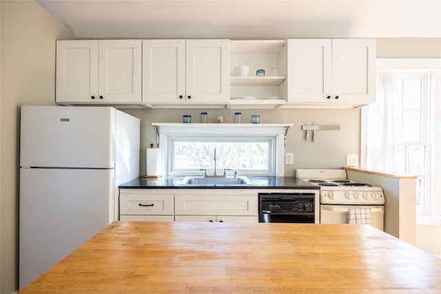 kitchen with white cabinetry, white appliances, sink, and wooden counters