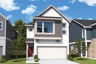 view of front of house featuring a garage and a front lawn