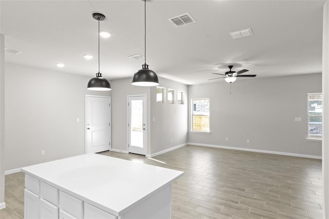 foyer entrance featuring ceiling fan