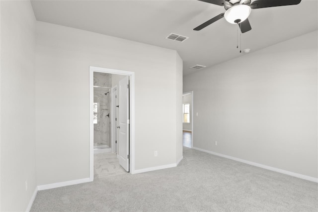 carpeted empty room with ceiling fan