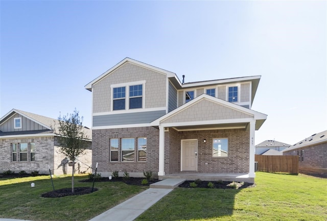 view of front of home with a front lawn and a porch