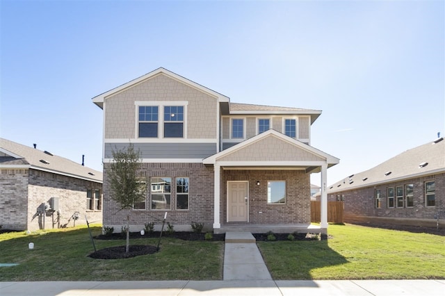 view of front of home featuring a front lawn and a porch