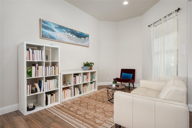 living area with hardwood / wood-style flooring