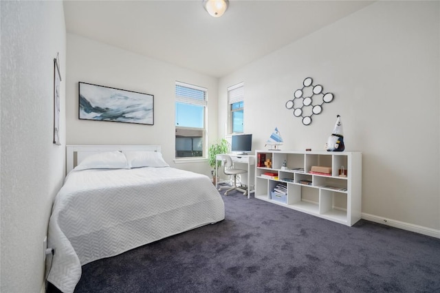 bedroom featuring dark carpet