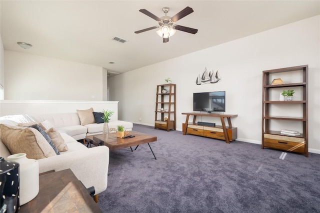 living room featuring ceiling fan and dark colored carpet