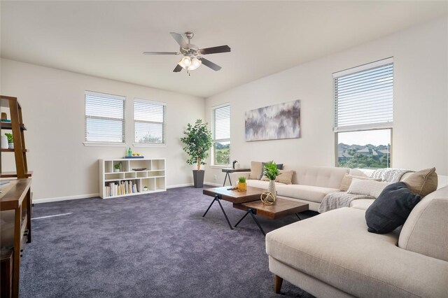 living room with ceiling fan and dark carpet