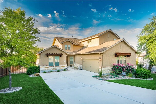 view of front of home featuring a garage and a front yard