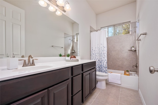 full bathroom with shower / tub combo, vanity, tile patterned floors, and toilet