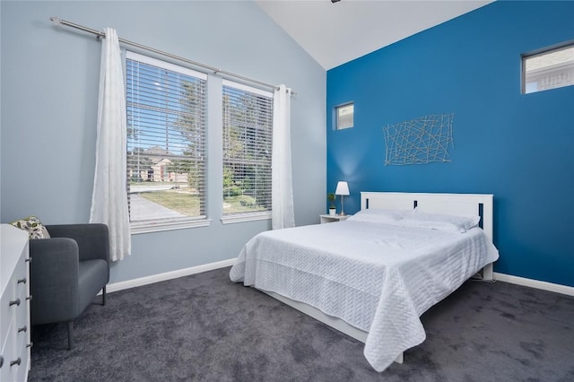 carpeted bedroom featuring lofted ceiling