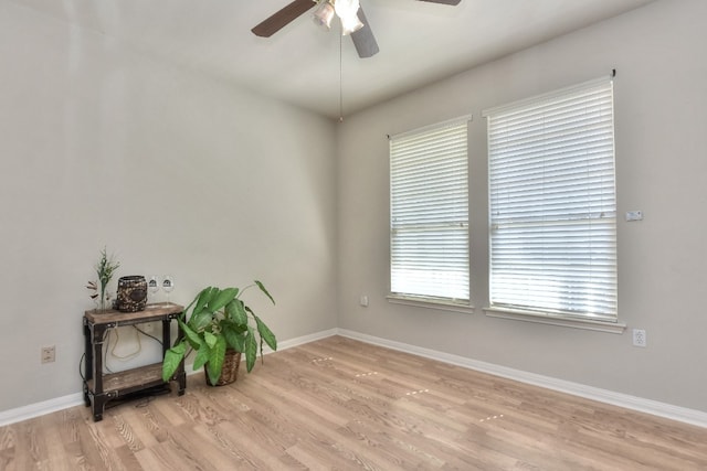 empty room featuring light hardwood / wood-style flooring and ceiling fan