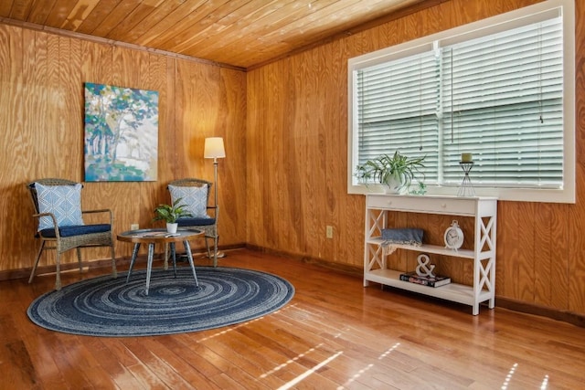192 Carmen Hill Ln, Bastrop, TX 78602 - living area with wooden ceiling, wood walls, and hardwood / wood-style flooring