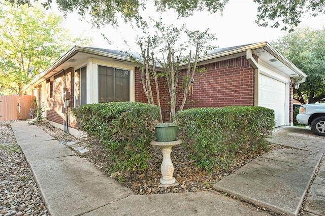 view of side of property featuring a garage