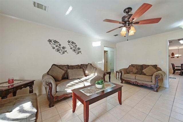 living room with ceiling fan, light tile patterned floors, and ornamental molding