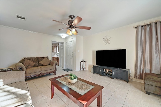 tiled living room featuring ceiling fan and ornamental molding