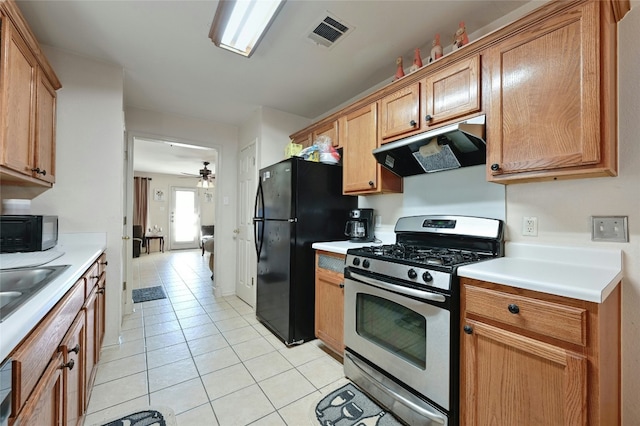 kitchen featuring ceiling fan, light tile patterned floors, and black appliances