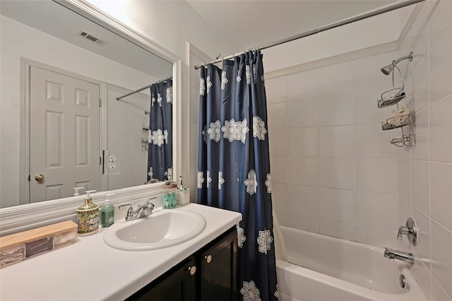 bathroom with vanity and shower / bath combo