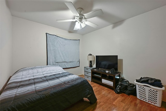 bedroom featuring ceiling fan and hardwood / wood-style floors