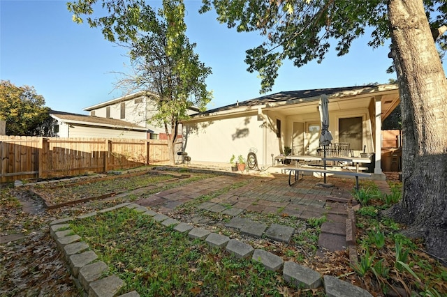 back of property featuring a patio