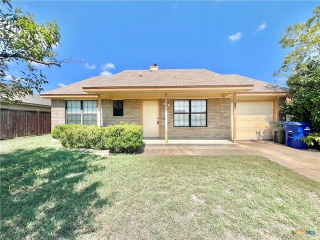 view of front facade with a front yard and a garage