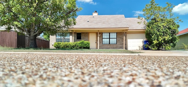 single story home featuring a garage