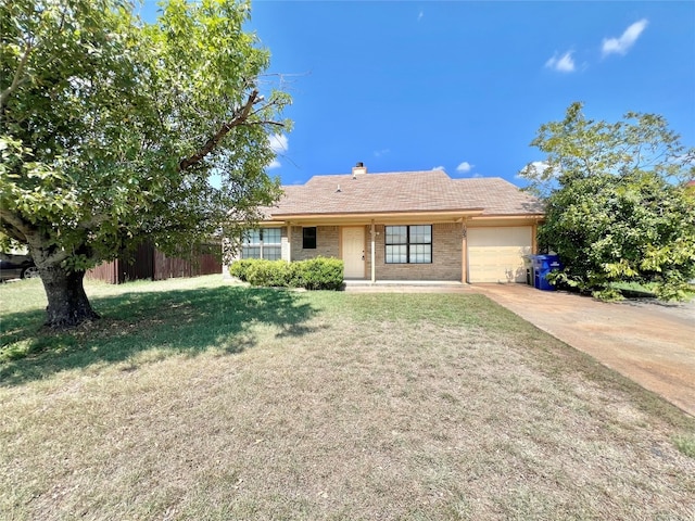 single story home featuring a garage and a front yard