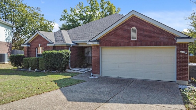 view of front of property with cooling unit, a front yard, and a garage