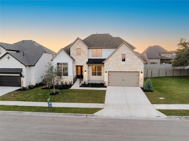 view of front of house with a lawn and a garage