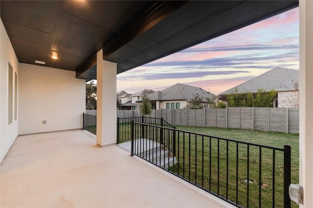 view of balcony at dusk