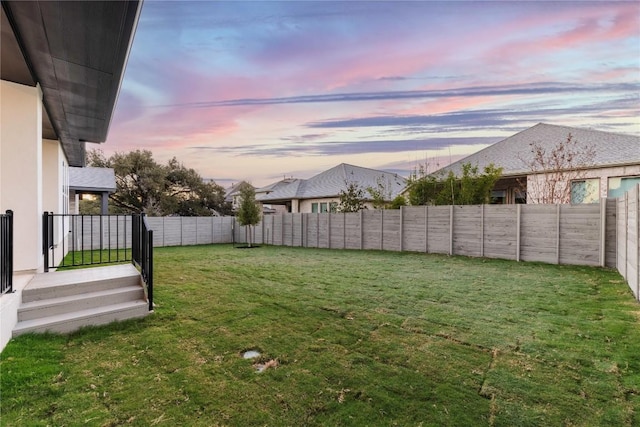 view of yard at dusk