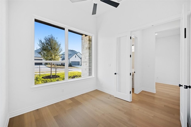 empty room featuring light hardwood / wood-style floors and ceiling fan