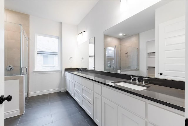 bathroom with vanity, tile patterned floors, and an enclosed shower