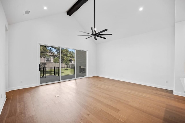 1509 Jay Wolf, Georgetown, TX 78628 - empty room with beamed ceiling, high vaulted ceiling, a ceiling fan, wood finished floors, and baseboards