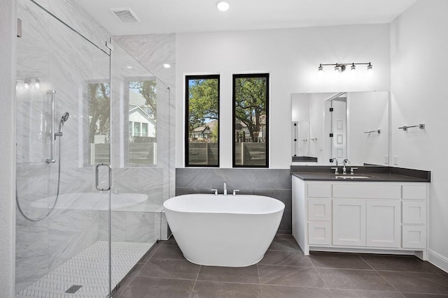 1509 Jay Wolf, Georgetown, TX 78628 - full bathroom featuring a freestanding tub, a marble finish shower, and vanity