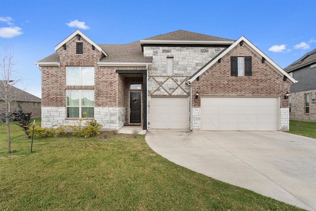 view of front of home featuring a front yard and a garage