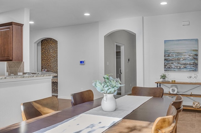 dining area featuring tile patterned flooring