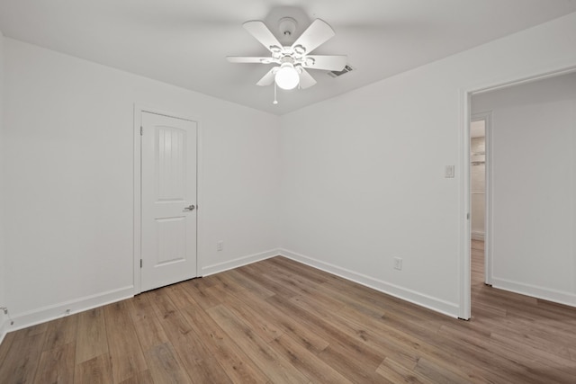 unfurnished room featuring ceiling fan and wood-type flooring