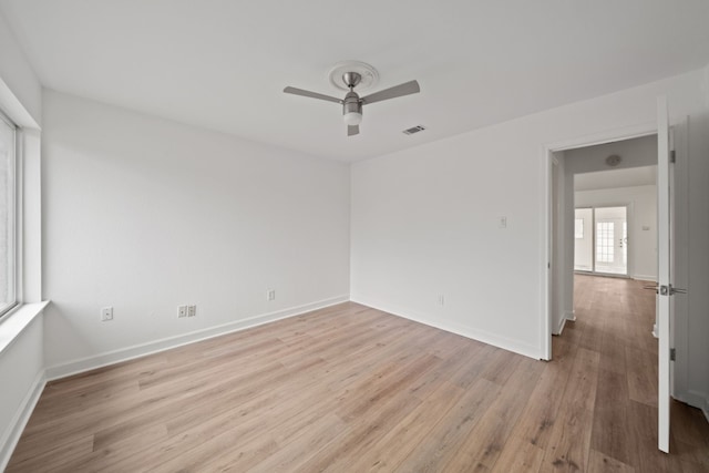 unfurnished room featuring ceiling fan and light hardwood / wood-style floors