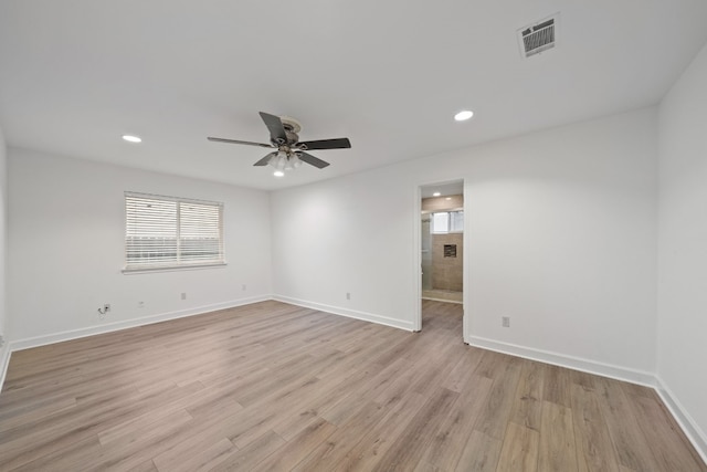 empty room featuring ceiling fan and light wood-type flooring