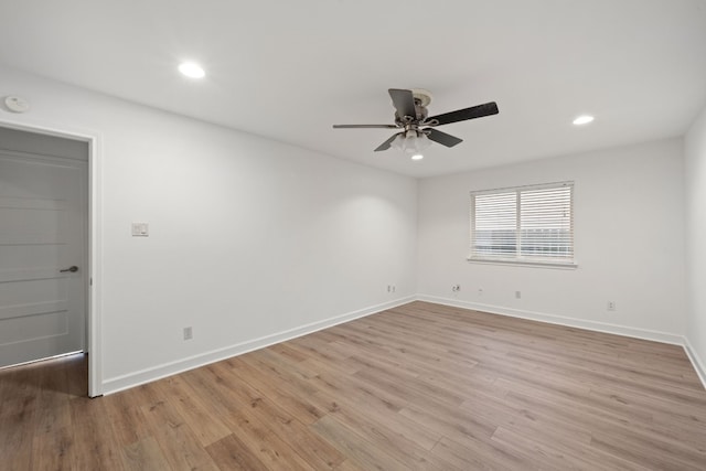 unfurnished room with ceiling fan and light hardwood / wood-style floors