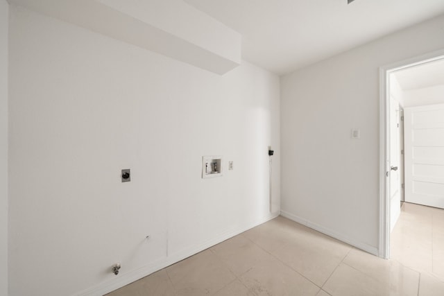 washroom featuring electric dryer hookup, hookup for a washing machine, and light tile patterned floors