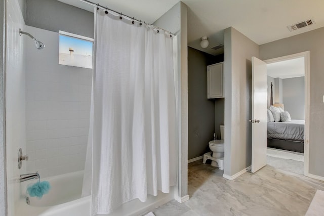 bathroom featuring toilet and shower / tub combo